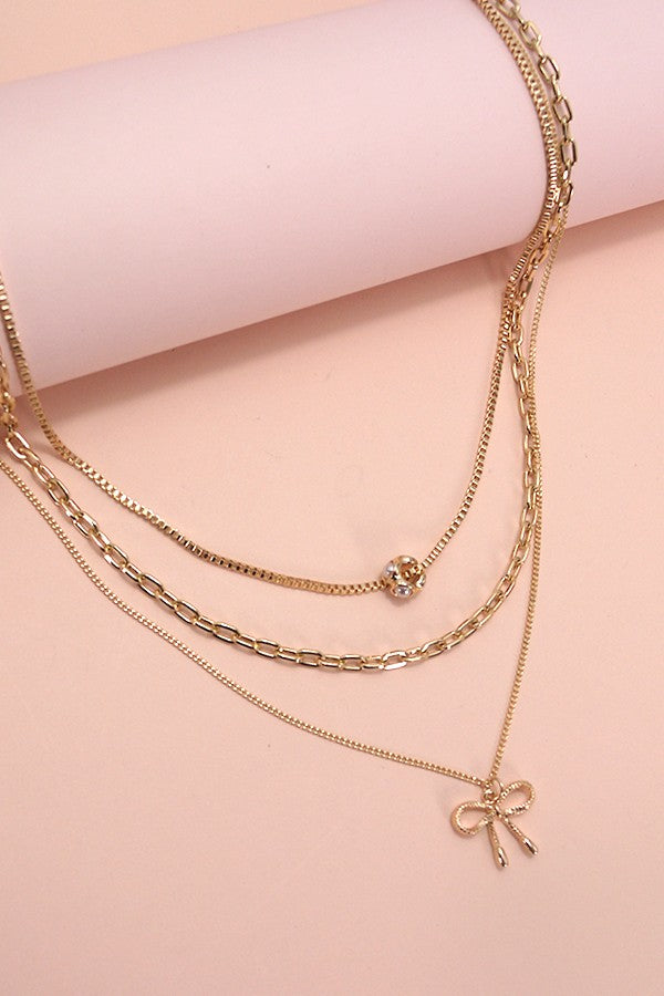BOW MULTI LAYER PEARL BOW CAHRM NECKLACE