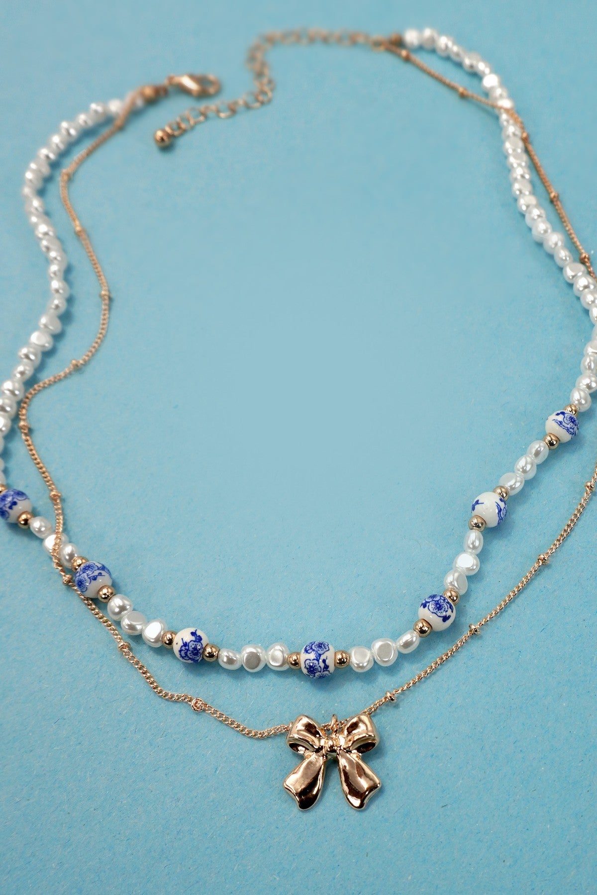 BLUE AND WHITE CERAMIC PORCELAIN PEARL BOW LAYER NECKLACE