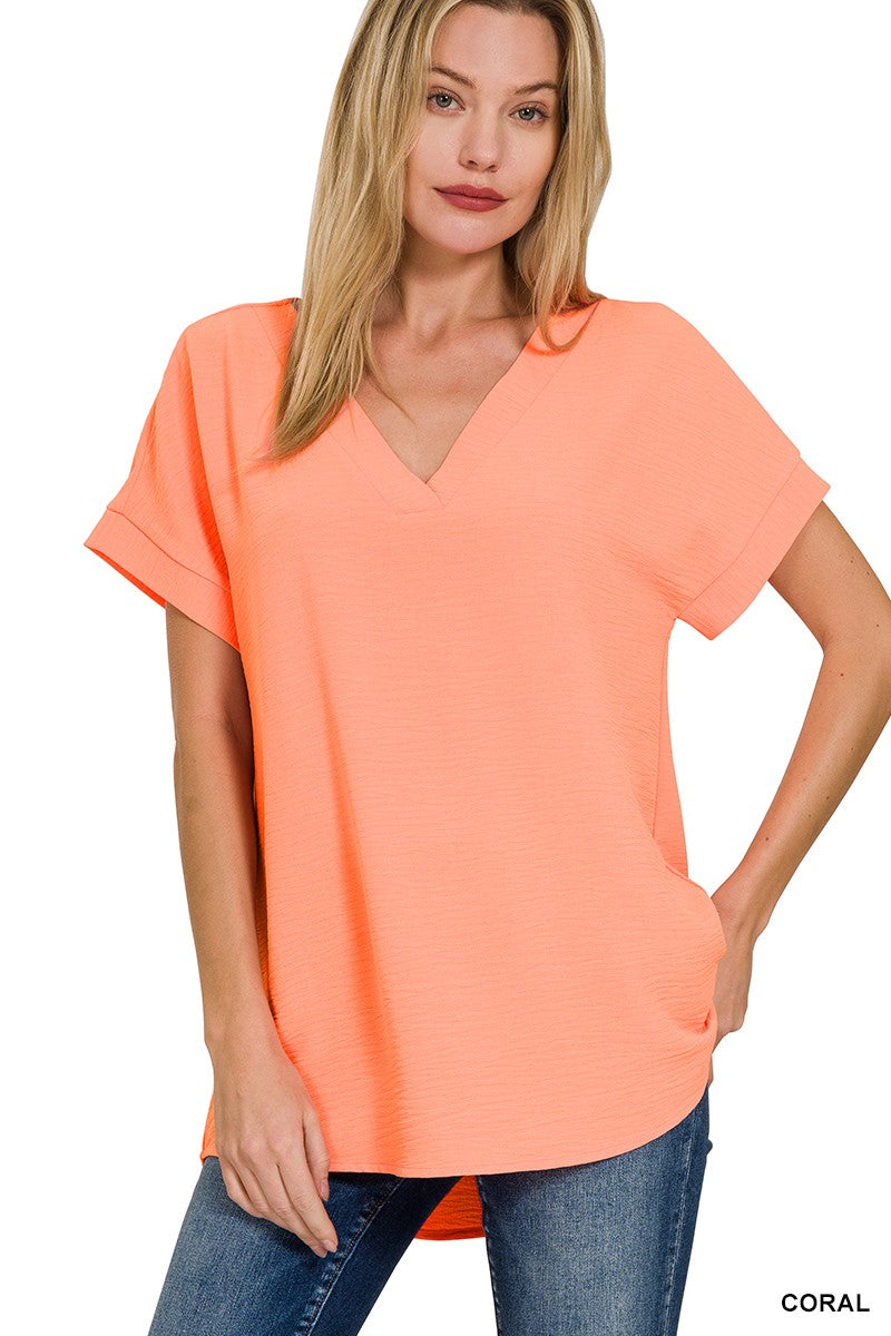 WOVEN AIRFLOW V-NECK HI-LOW HEM TOP